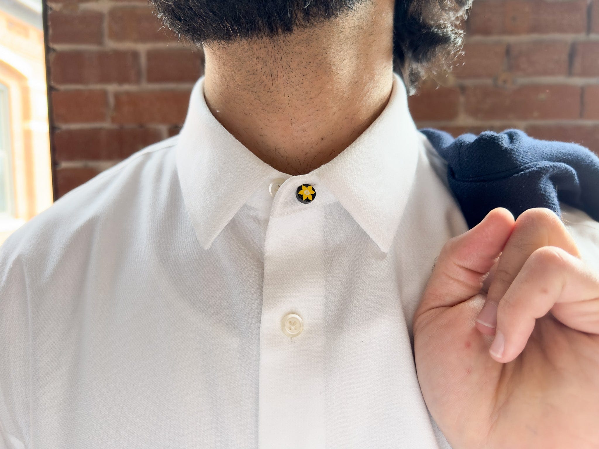 Front view of model wearing of COCHIC and Canadian Cancer Society's Daffodil Shirt Collar Extender
