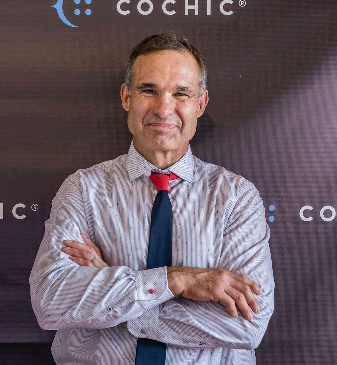 front picture of a man wearing a red cuff extender and blue cuff extender