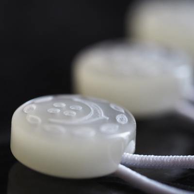 Side view of a white shirt collar extender