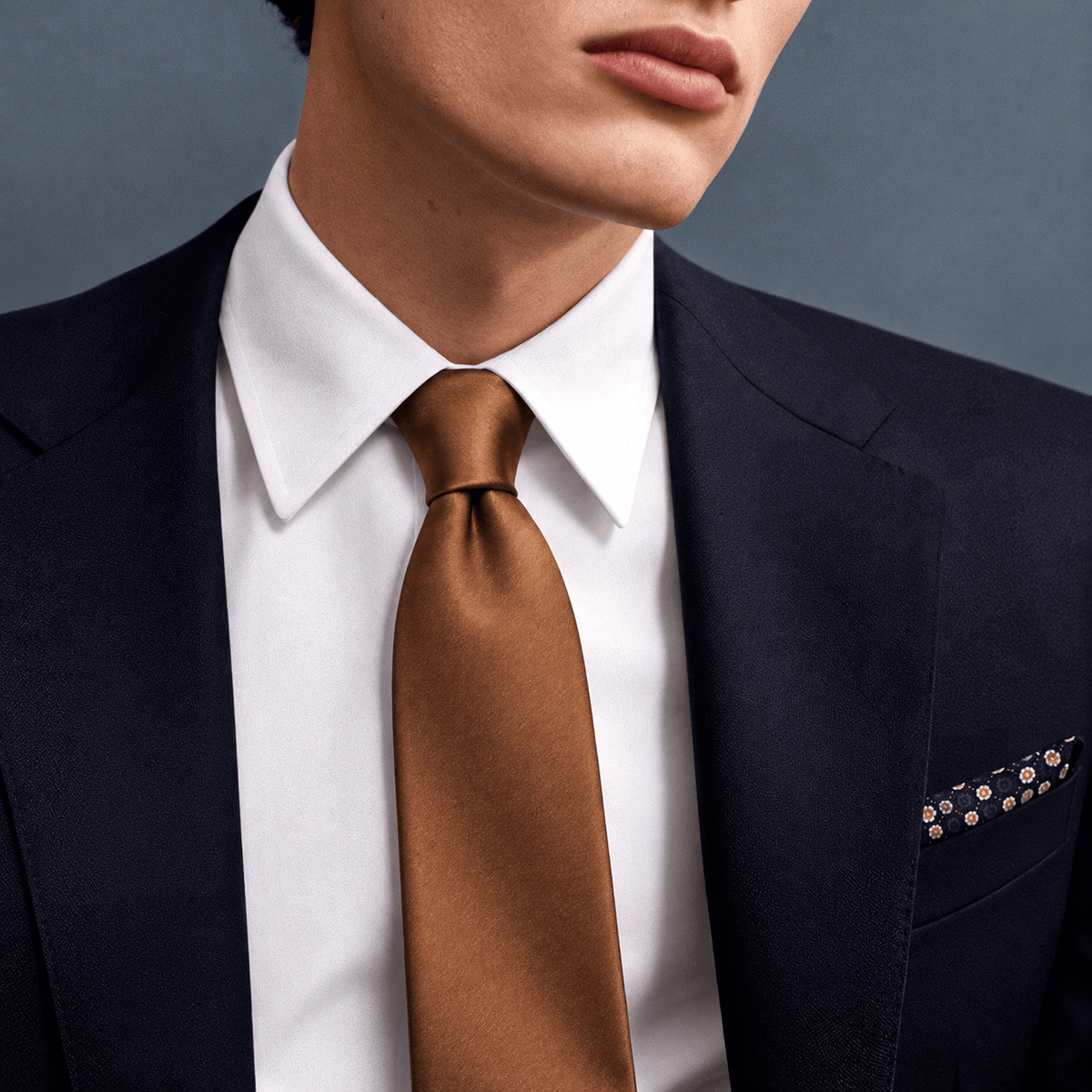 THE COGNAC - BOTTIGLIA TIE worn with a navy suit