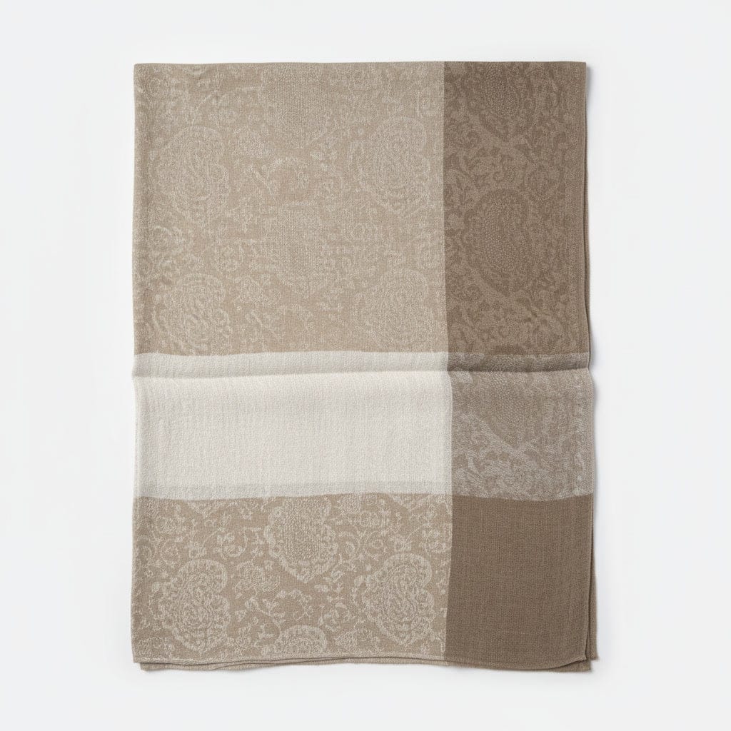 Patterned scarf in shades of brown and beige on a white background