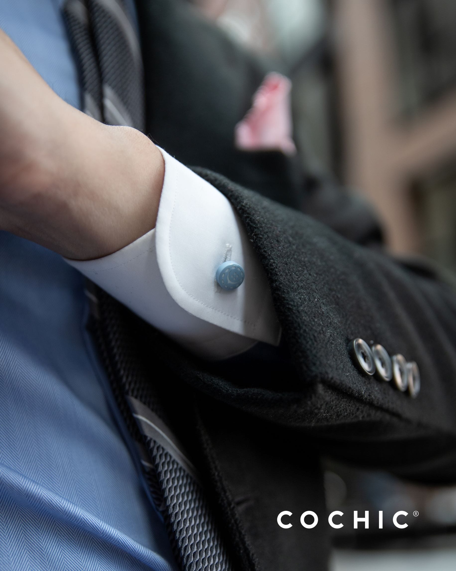Front picture of man using the blue shirt collar extender as cufflinks
