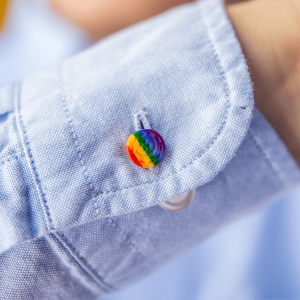 front view of man wearing a LGBTQ+ cuff extender